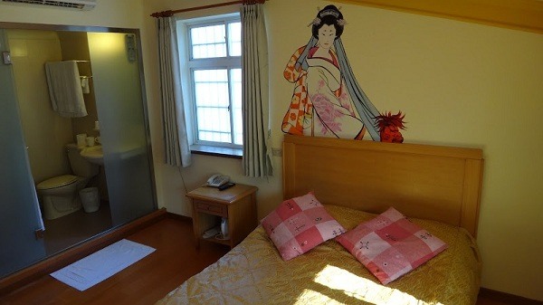 a Geisha watches over us while we sleep in our Sun Moon Lake accommodation