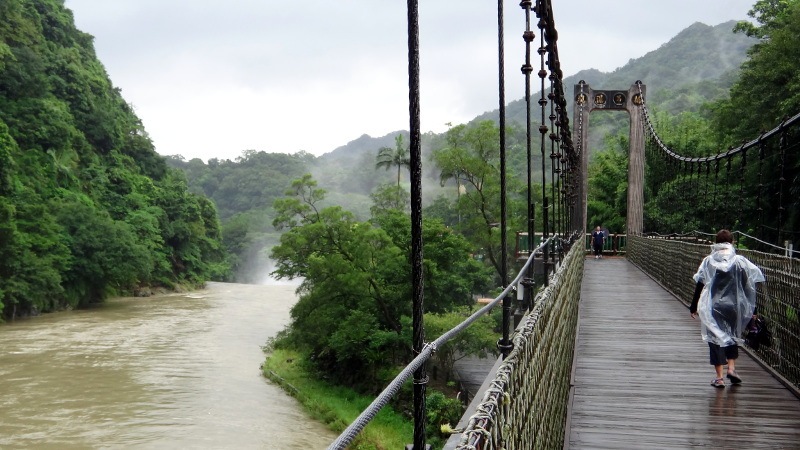 Walking across a bridge near the Shifen waterfall on the Pinxi line